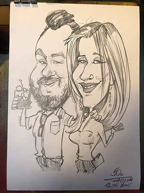 Karikaturista Janko a jeho ruční kresba na A3: společná karikatura páru s občerstvením z oslavy.